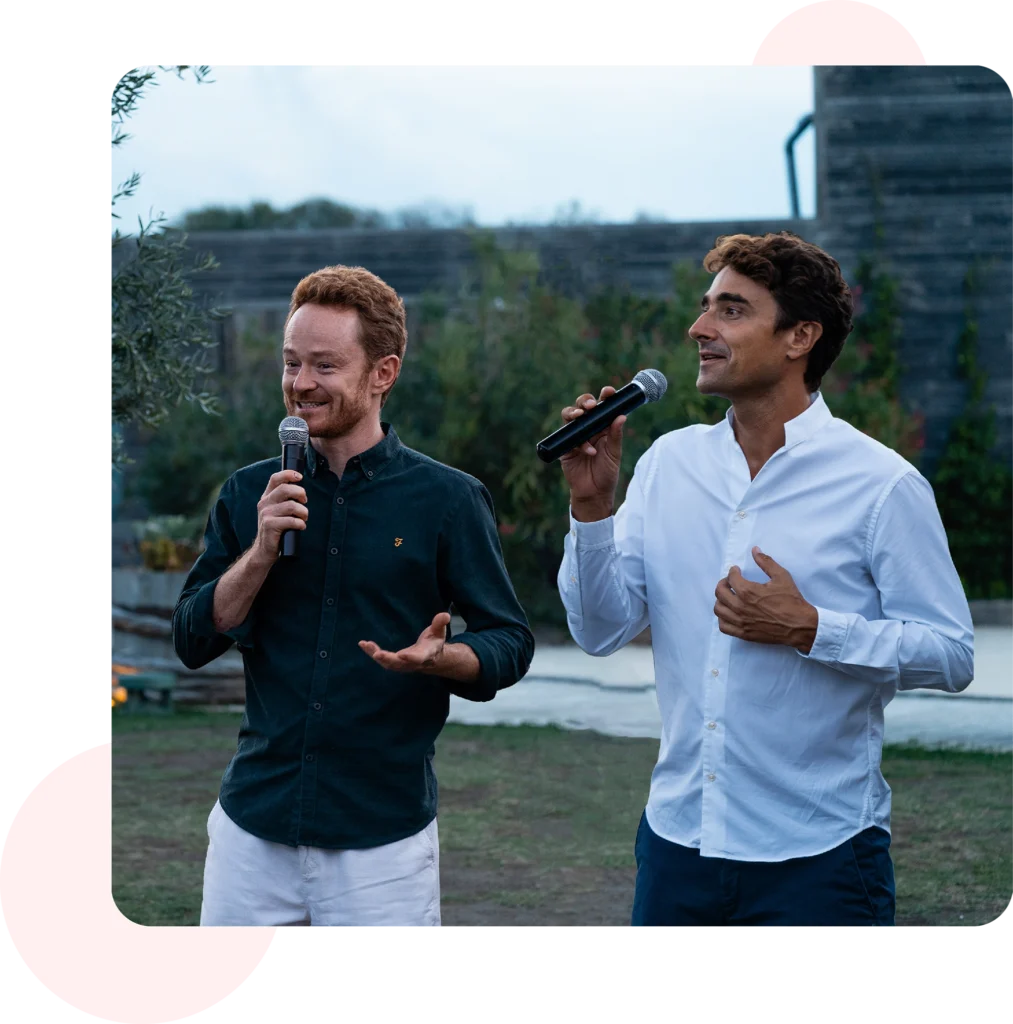 UpSlide's co-founders, Antoine Vettes and Philippe Chazalon, delivering a speech