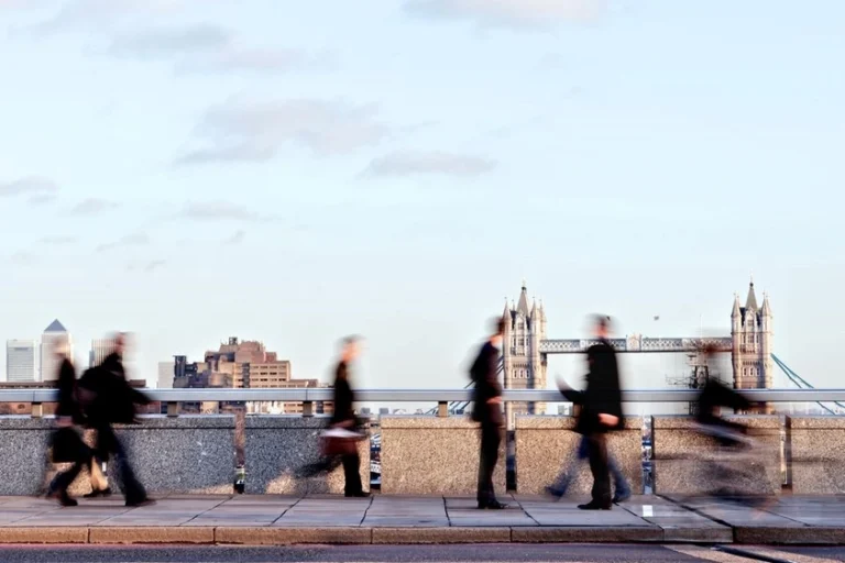 Bankers rushing down a busy street